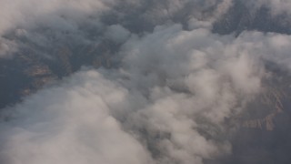 WA002_012 - 4K stock footage aerial video fly over dense clouds and tilt to mountains in Los Padres National Forest, California