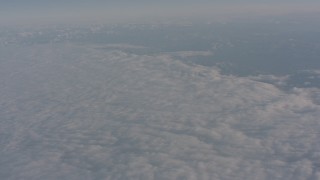 WA002_024 - 4K stock footage aerial video tilt to the edge of a dense layer of clouds over Central Valley, California