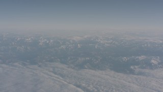 WA002_035 - 4K stock footage aerial video of a layer of clouds around the Sierra Nevada Mountains, California