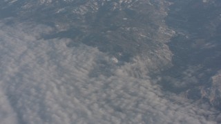 WA002_041 - 4K stock footage aerial video of the edge of cloud layer beside Sierra Nevada Mountains, California