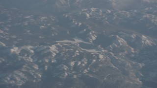 WA002_042 - 4K stock footage aerial video of an icy lake in the Sierra Nevada Mountains, California