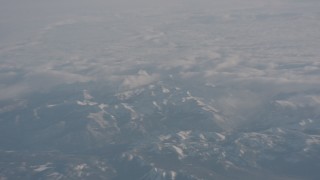 WA002_043 - 4K stock footage aerial video of a layer of clouds behind the Sierra Nevada Mountains, California