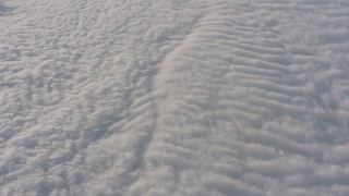 WA002_045 - 4K stock footage aerial video of a reverse view of rippled white clouds over the Central Valley, California