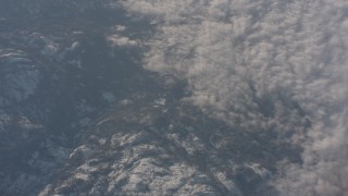 WA002_046 - 4K stock footage aerial video of a bird's eye view of clouds beside the Sierra Nevada Mountains, California