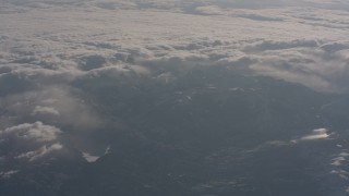 WA002_049 - 4K stock footage aerial video of the Sierra Nevada Mountains and clouds rolling over them, California