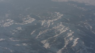 WA002_056 - 4K stock footage aerial video fly away from snow-covered ridges in the Sierra Nevada Mountains, California