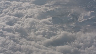 WA002_061 - 4K stock footage aerial video fly away from dense misty clouds over the Sierra Nevada Mountains, California
