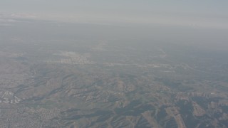 WA003_006 - 4K stock footage aerial video of the San Fernando Valley seen from Simi Hills, California