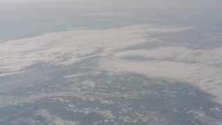 WA004_015 - 4K stock footage aerial video of a reverse view of clouds over snowy mountains in Modoc County, California