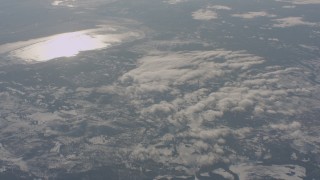 WA004_020 - 4K stock footage aerial video tilt from snowy hills to reveal lakes in Lake County, Oregon
