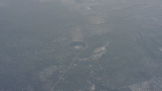 WA004_022 - 4K stock footage aerial video of reverse view of the Hole-in-the-Ground crater in Lake County, Oregon