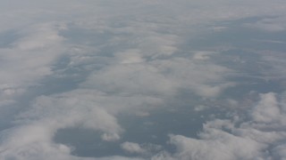 WA004_026 - 4K stock footage aerial video tilt from dense cover of clouds over Lake County, Oregon