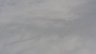 WA004_029 - 4K stock footage aerial video fly above white clouds over Lake County, Oregon