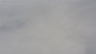 WA004_030 - 4K stock footage aerial video fly over misty white clouds over Lake County, Oregon