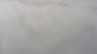 WA004_032 - 4K stock footage aerial video of a reverse view of dense white clouds over Lake County, Oregon
