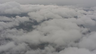 WA004_033 - 4K stock footage aerial video of patchy white clouds over Lake County, Oregon