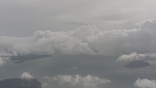WA004_039 - 4K stock footage aerial video of passing clouds above Puget Sound, Washington