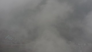 WA004_042 - 4K stock footage aerial video of a bird's eye view of Puget Sound seen while flying through misty clouds, Washington