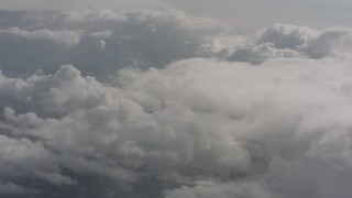 WA004_052 - 4K stock footage aerial video fly through misty clouds toward more clouds over Washington