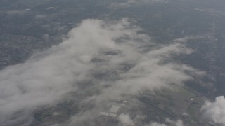 WA004_058 - 4K stock footage aerial video fly over misty clouds over Snohomish County, Washington