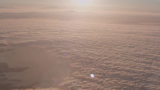 WA005_010 - 4K stock footage aerial video fly over cloud layer covering the Pacific Ocean at sunset near San Pedro, California