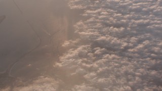 WA005_011 - 4K stock footage aerial video of a bird's eye view of clouds over ocean at sunset by Long Beach, California
