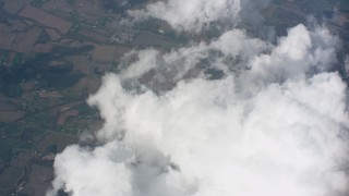 WA005_082 - 4K stock footage aerial video of tilt from larger cloud formations to smaller clouds over Ohio farmland