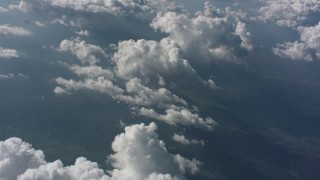 WA005_094 - 4K stock footage aerial video tilt from a cloud to a wider view of cloud cover in the background over West Virginia