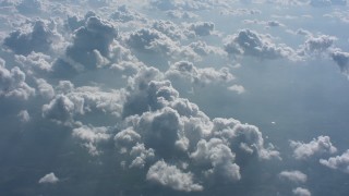WA005_103 - 4K stock footage aerial video flyby cloudy skies backlit by the sun over West Virginia