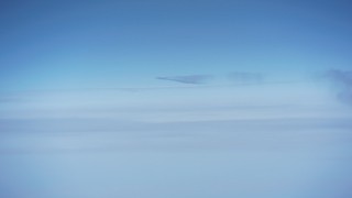 WA007_017 - 4K stock footage aerial video of a jet contrail above the clouds over North Carolina