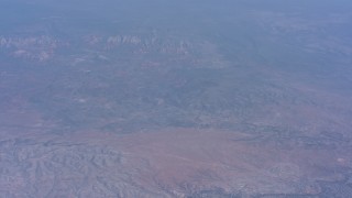 WA007_026 - 4K stock footage aerial video tilt from a view of Cottonwood, Arizona to desert mountains in the background