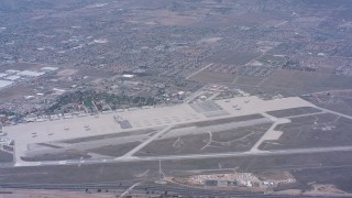 WA007_038 - 4K stock footage aerial video reverse view of March Joint Air Reserve Base and military planes in Riverside, California