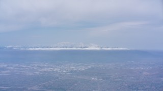 WA007_040 - 4K stock footage aerial video of the San Gabriel Mountains with snow seen from Riverside, California