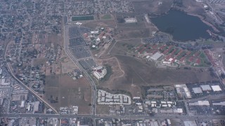 WA007_042 - 4K stock footage aerial video of a bird's eye view of suburban homes, I-15 and a lake in Norco, California