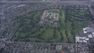 WA007_050 - 4K stock footage aerial video fly over golf course to approach juvenile hall in Downey, California