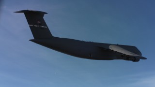 WAAF01_C005_0117RV - 4K stock footage aerial video of a Lockheed C-5 and blue skies, Northern California