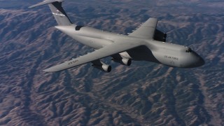 WAAF01_C015_0117VN - 4K stock footage aerial video of flying by the front end of a Lockheed C-5 flying over hills, Northern California