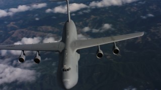 WAAF01_C040_0117SL - 4K stock footage aerial video flyby front of a Lockheed C-5 jet in Northern California