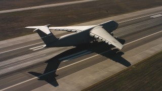 WAAF01_C085_01177E - 4K stock footage aerial video of a Lockheed C-5 landing at Travis Air Force Base, Northern California