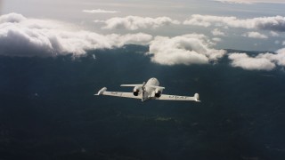 WAAF02_C029_0117CV_S001 - 4K stock footage aerial video of following a Learjet C-21 toward the ocean in Northern California