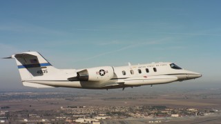 WAAF02_C063_01178T - 4K stock footage aerial video of a Learjet C-21 near Travis Air Force Base, California