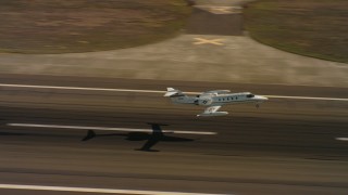 WAAF02_C066_0117D0_S000 - 4K stock footage aerial video of a Learjet C-21 taking off from Travis Air Force Base, California