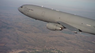 WAAF03_C007_01183X - 4K stock footage aerial video of a McDonnell Douglas KC-10 flying over hills in Northern California