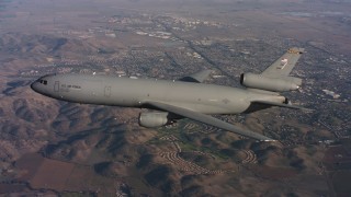 WAAF03_C009_0118C0 - 4K stock footage aerial video of a McDonnell Douglas KC-10 flying over hills in Northern California