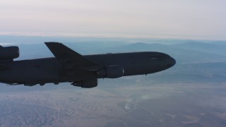 WAAF03_C016_0118KH - 4K stock footage aerial video of a McDonnell Douglas KC-10 flying away in Northern California