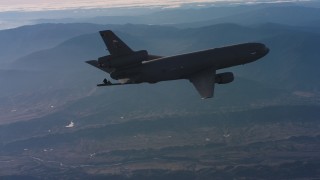 WAAF03_C022_0118MW - 4K stock footage aerial video of a McDonnell Douglas KC-10 with lowered refueling boom in Northern California