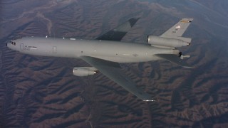 WAAF03_C024_0118QQ - 4K stock footage aerial video of a McDonnell Douglas KC-10 flying over hills in Northern California