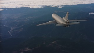 WAAF03_C029_01181U - 4K stock footage aerial video of a McDonnell Douglas KC-10 in flight over mountains in Northern California