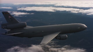 WAAF03_C032_01180B - 4K stock footage aerial video of a McDonnell Douglas KC-10 flying over mountains and clouds in Northern California