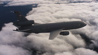 WAAF03_C033_011806 - 4K stock footage aerial video of a McDonnell Douglas KC-10 flying over clouds in Northern California